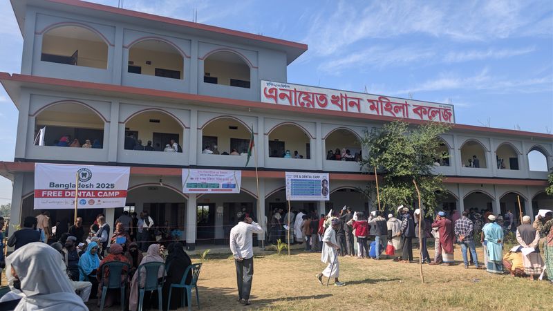The college with the camp banners and the queue